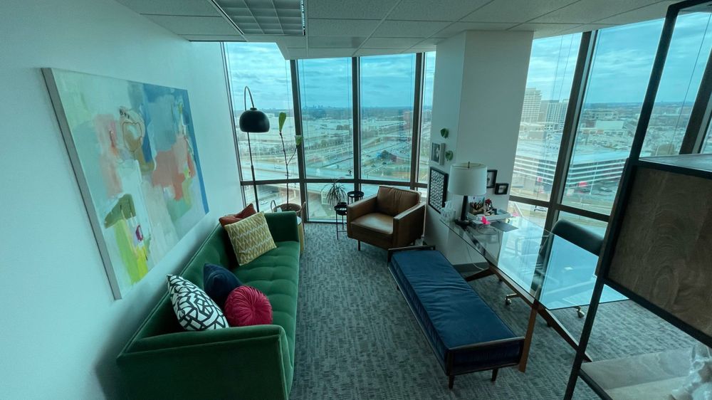 The interior of a Dallas Therapy Associates office — walnut shelving, warm natural light, mid-century furnishings